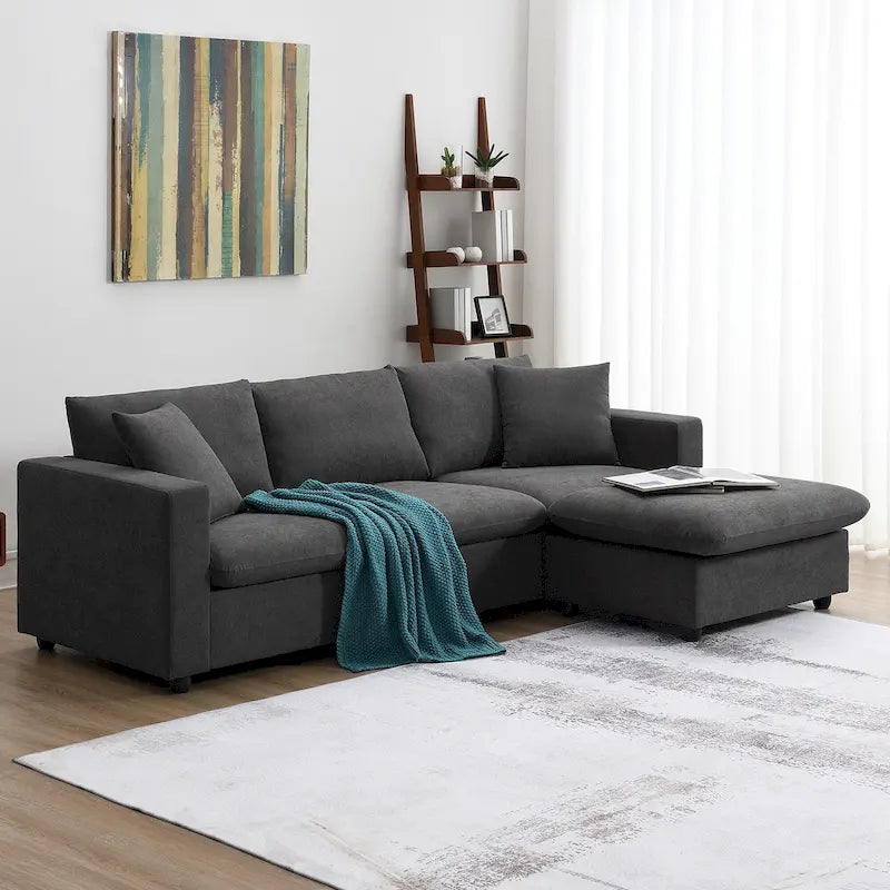 Sofá seccional en L de 4 plazas en gris/negro/blanco/beige con otomana