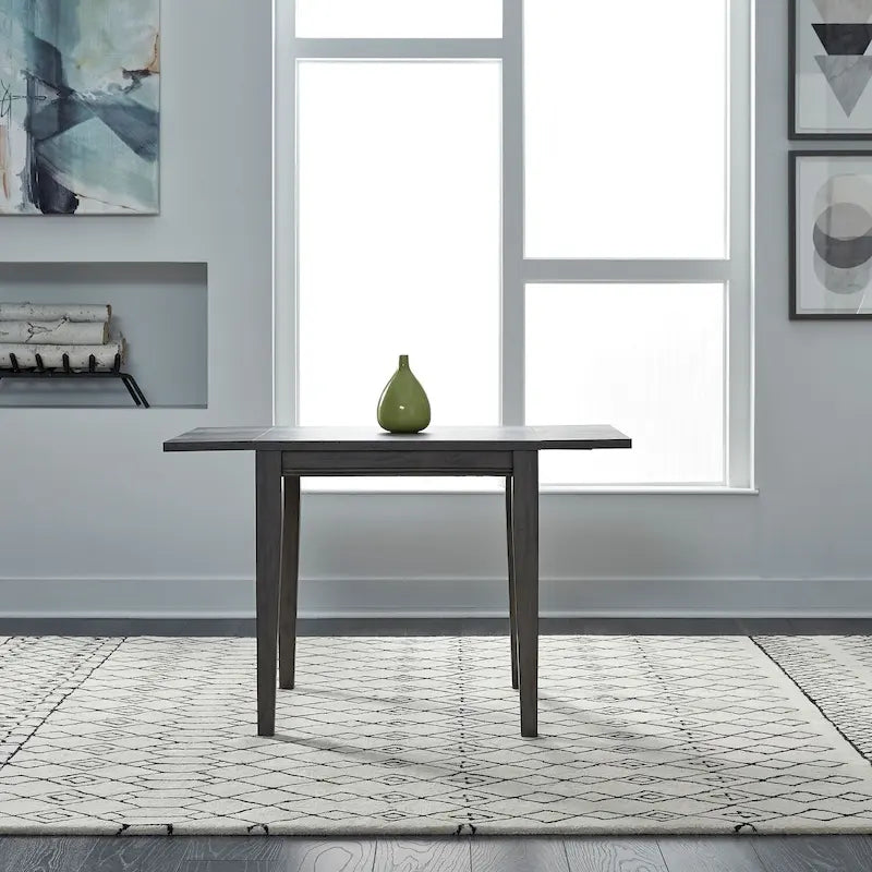 Mesa de comedor gris con alas abatibles, capacidad 2–4 personas