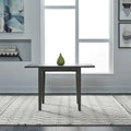 Mesa de comedor gris con alas abatibles, capacidad 2–4 personas