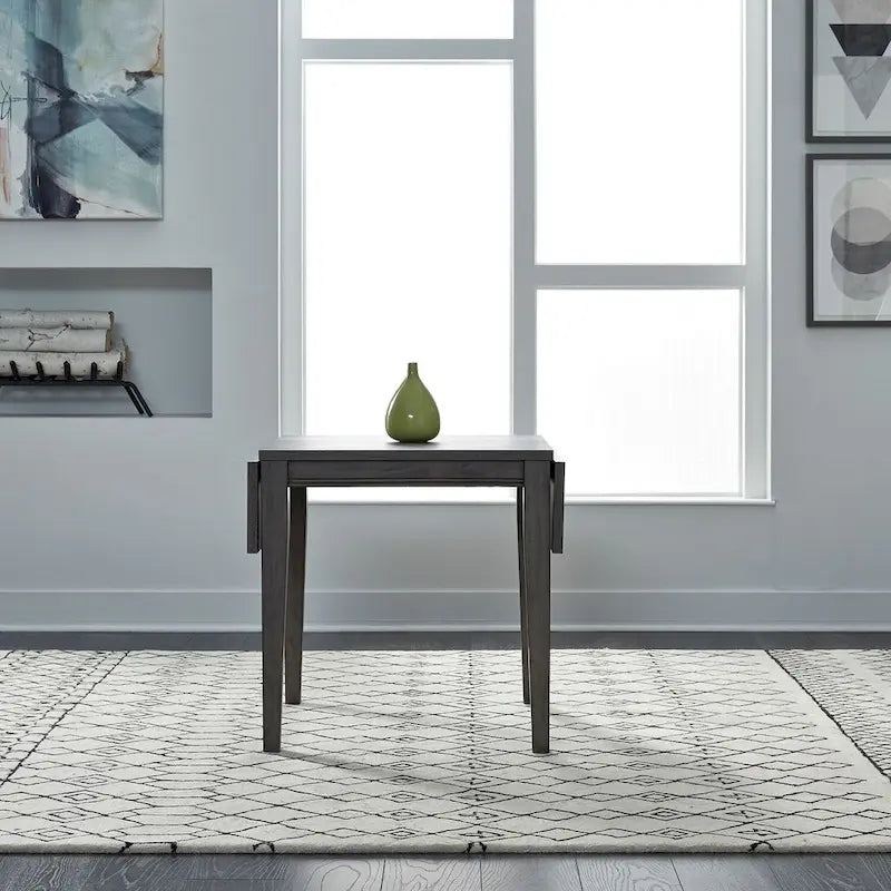 Mesa de comedor gris con alas abatibles, capacidad 2–4 personas